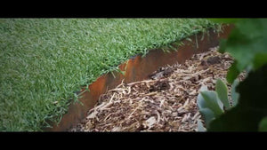 Core Edge Flexible Steel Lawn Edging show in CorTen edging dividing grass from gravel path - Edge It Co by Henderson Supply