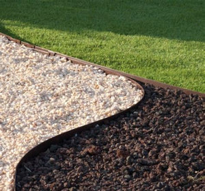 Core Edge Flexible Steel Lawn Edging show in Brown edging dividing grass from gravel path - Edge It Co by Henderson Supply