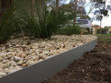 Load image into Gallery viewer, Core Edge Flexible Steel Lawn Edging shown in Light Grey as border of flower bed - Edge It Co by Henderson Supply