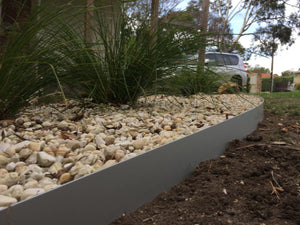 Core Edge Flexible Steel Lawn Edging shown in Light Grey as border of flower bed - Edge It Co by Henderson Supply